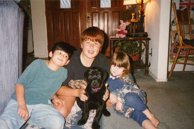 My three kids with our Lab puppy Monty 1990s California (c) Sherri Matthews