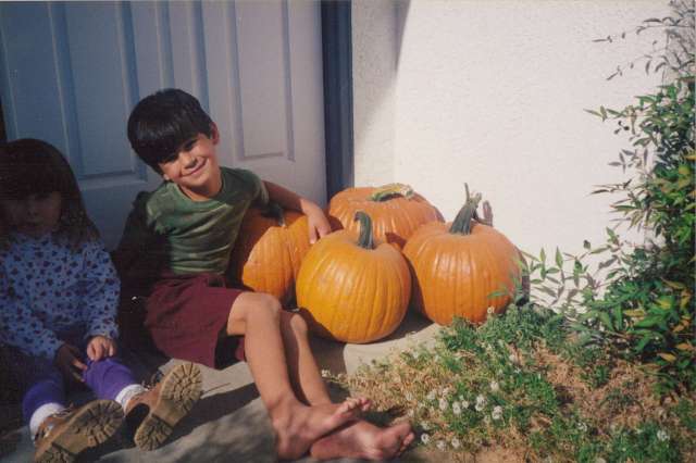 Nicky and home-grown pumpkins on our front porch, California 1990s (c) Sherri Matthews